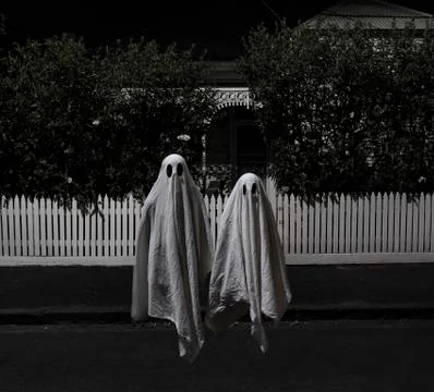 Two scary ghosts floating outside a house 스톡 사진