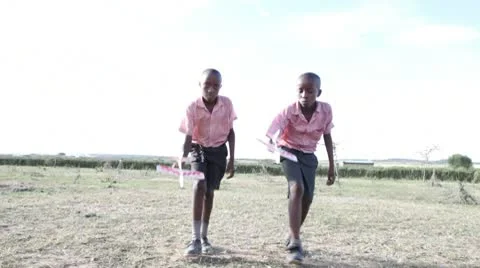 Two school boys playing with toy planes. Video stock 9279310
