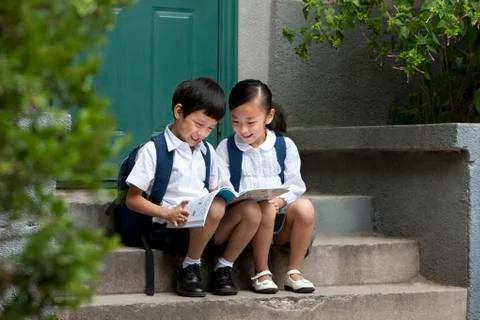 Two school children studying outside Stock Photos