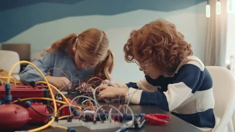 Two School Kids Constructing Robots Video stock 153463971