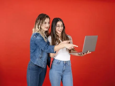 Two schoolmates or colleagues using laptop pc computer Stock Photos
