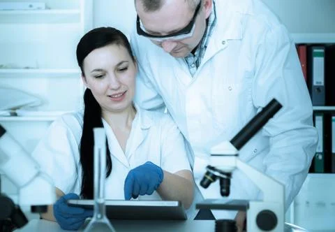 Two scientist in laboratory. Stock Photos