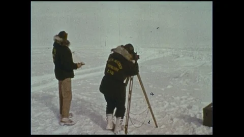 Two scientist release a red balloon as a typer sends information electronically. Stock Footage