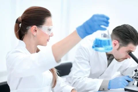 Two scientists are working in laboratory. Stock Photos