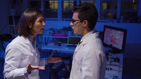 Two scientists arguing furiously in laboratory 스톡 동영상 124715866