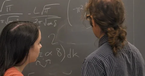 Two scientists or mathematicians agreeing on a solution to a complex problem Stock Footage 106075974
