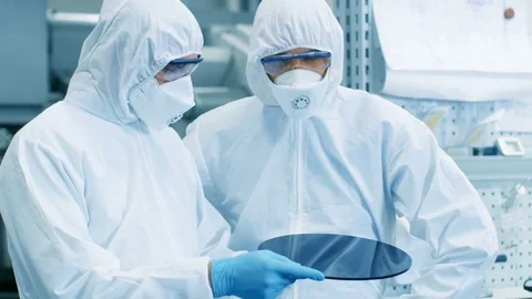 Two Scientists in Sterile Suits Check Semiconductor Silicon Wafer. Видео 82266148