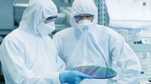 Two Scientists/ Technicians in Sterile Suits Check Semiconductor Silicon Wafer  Stock Footage 82266167