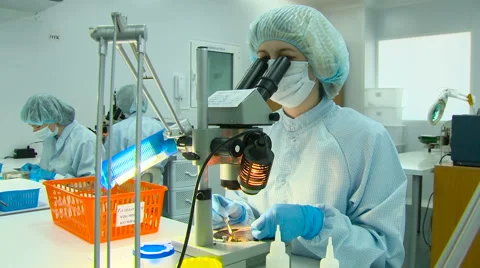 Two Scientists Working in the Laboratory, Microscopes, Sterile Stock Footage 61008843