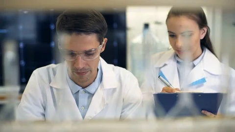 Two scientists working together at the laboratory Stock Footage 74933023