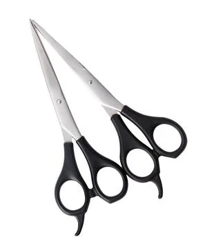 Two scissors with a black handle and a silver blade Stock Photos