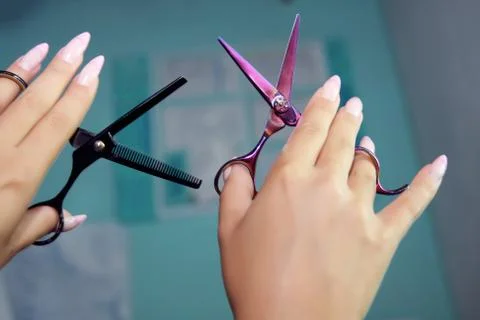 Two scissors, opening and closed thinning shears for Hairdresser Stock Photos