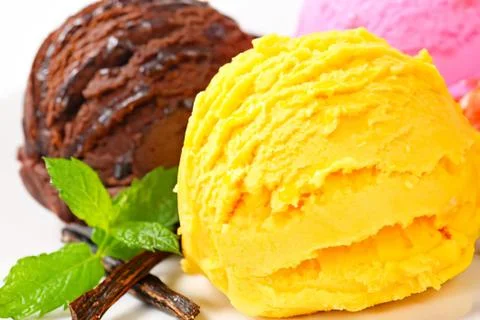 Two scoops of ice cream with mint and vanilla bean Stock Photos