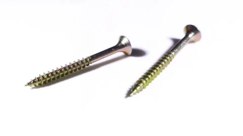 Two screws spinning on a white background Stock Footage 155161592