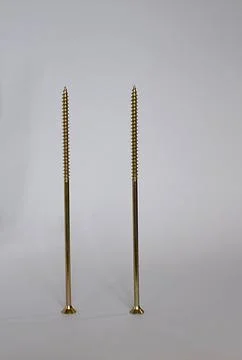Two screws upright on a white background Stock Photos