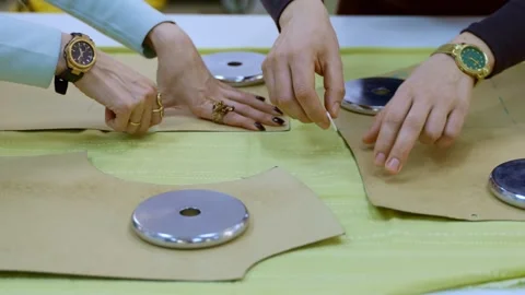 Two Seamstresses Collaborating on Fabric Marking Before Cutting in a Bright Vidéo 336247383