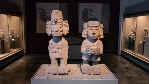 Two Seated Stone Figures on Museum Platform, Mexico 8K Stock Footage 340369484