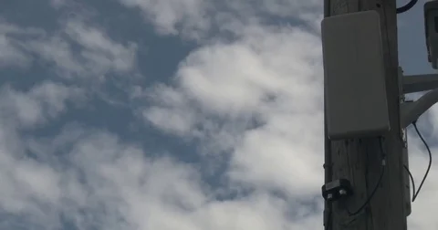 Two Security Cameras on Utility Pole - Pan Stock Footage 76922329