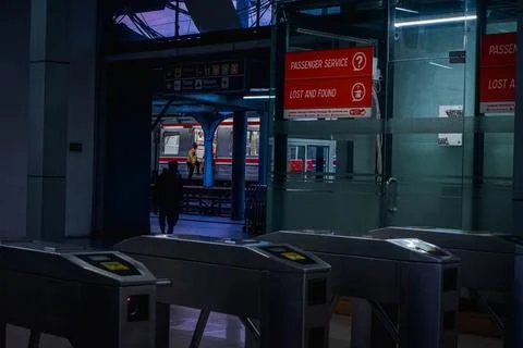 Two Security Guards of a Train Station Doing Their Job in the Evening Stock Photos