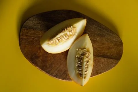 Two segments of melon with seeds Stock Photos