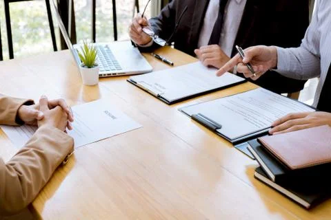 Two selection committee manager reading a resume during a job interview, Empl Stock Photos