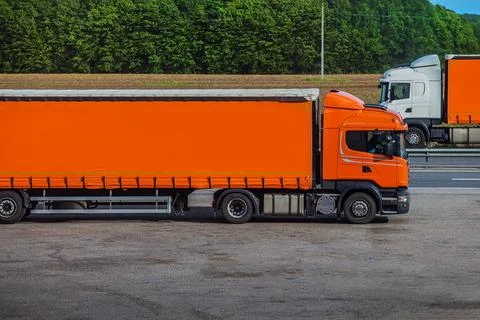 Two semi-trailers running in opposite directions Stock Photos