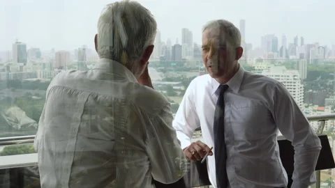 Two senior businessman take a break smoking cigarette and discussing business Stock Footage 158520798