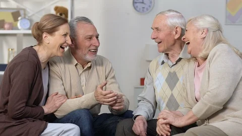 Two senior couples talking and laughing in nursing home, friends communication Stock Footage 108070824