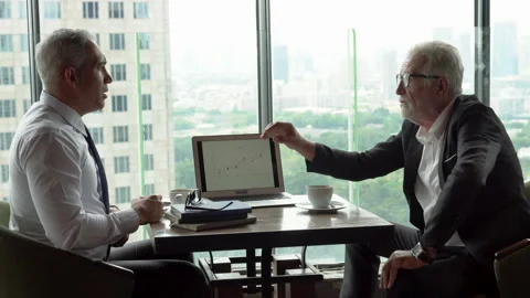 Two senior management businessman debating  in meeting with data information Stock Footage 137719481