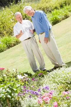 Two senior men in a flower garden Stock Photos