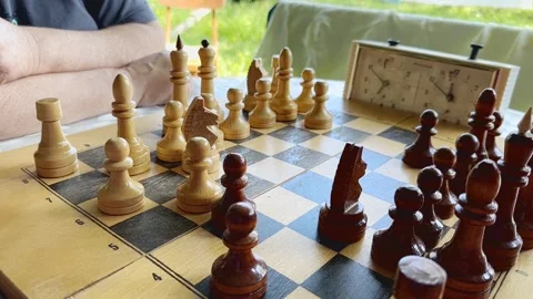 Two senior men having fun and playing chess game at park. Stock Footage 246474561