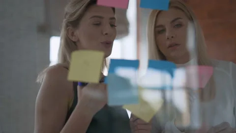 Two serious business developer developers work on a project in an office. modern 스톡 동영상 120651492