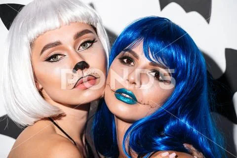 Two serious young women in halloween costumes Stock Photos