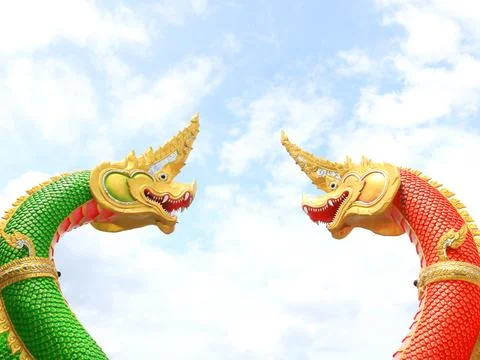 Two serpent statue and sky background. Stock Photos