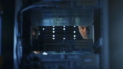 Two Server Engineers Install Hardware in Server Rack. They Work in Big Modern Da Stock Footage 74629777