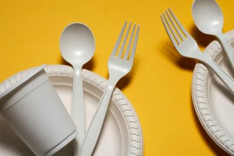 Two sets of disposable biodegradable cookware made from corn starch Stock Photos