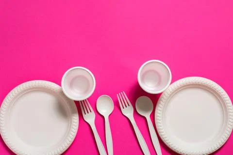 Two sets of disposable spoons, forks, plates and glasses of corn starch Фото