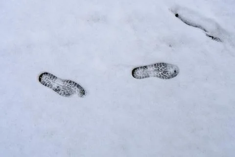 Two sets of footprints in the snow Foto stock