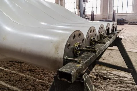 Two sets of new blades for wind generators in the factory floor close-up Stock Photos
