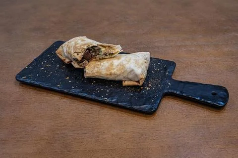 Two Shawarma Wraps on Serving Board Still Life Stock Photos
