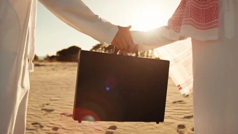 Two Sheiks Completing The Deal Passing The Money Briefcase Stock Footage 301925013