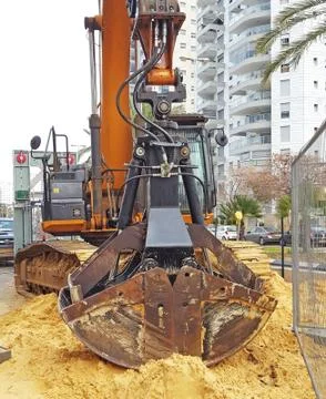 Two shell grapple.A  grapple is a hydraulically powered claw with two or more Stock Photos