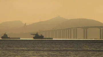 Two ships anchored close to a bridge Stock Footage 86119920