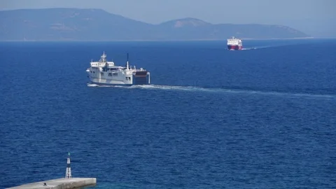 Two Ships in the sea with a small lighthouse Stock Footage 117298152