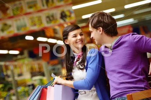 Two shopaholics chatting after good shopping in the mall Stock Photos