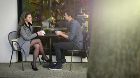 Two shot of cute couple on date outside cafe Stock Footage 61718150