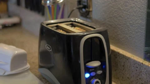 Two Shots Of Cooking Bread In A Toaster For A Home Cooking Show Stock Footage 159182662