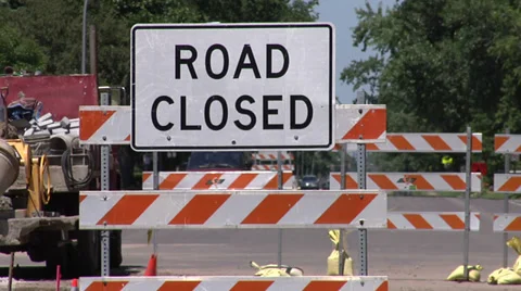 Two shots (wide and medium) of "Road Closed" traffic sign Video stock 34433448