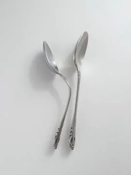 Two side-by-side spoons Stock Photos