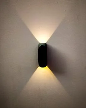 Two sided wall light with yellow light 스톡 사진